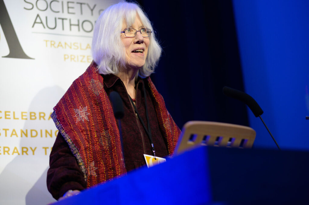 Marilyn Booth at the lectern addressing the audience
