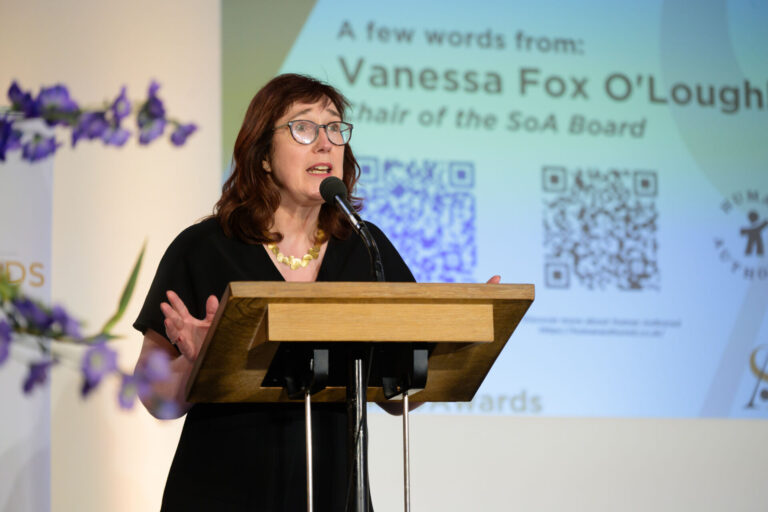 Vanessa Fox O'Loughlin standing at a podium